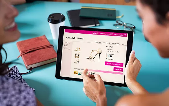 Customer completing an online purchase on a tablet